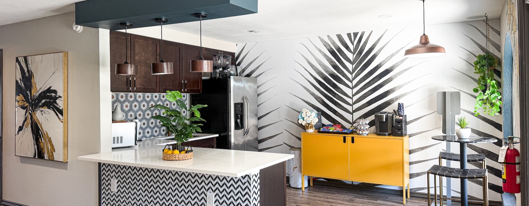a kitchen with a bar and a table