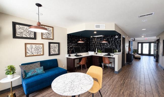 a living room with a blue couch and a table